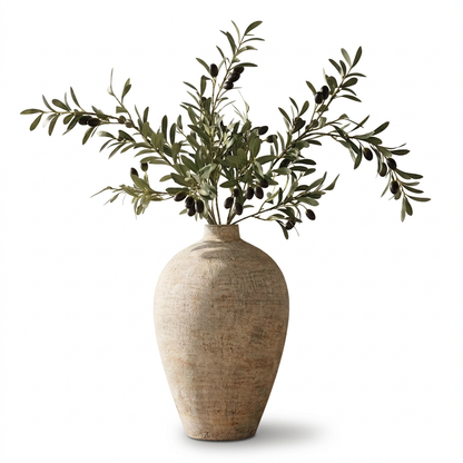 Faux olive branch arrangement with textured beige vase on white background
