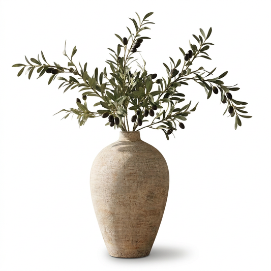 Faux olive branch arrangement with textured beige vase on white background