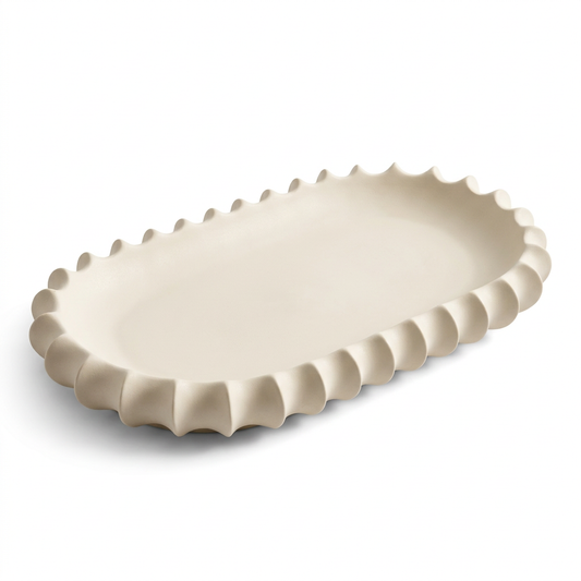 Ivory ceramic decorative tray with sculptural fluted rim on white background